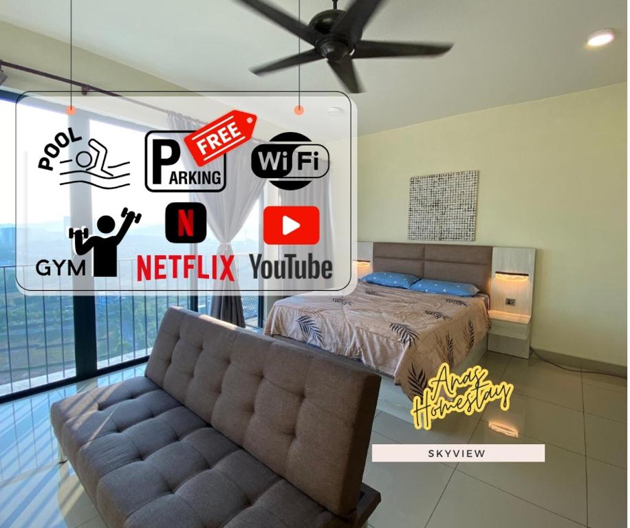 a bedroom with a bed and a couch in a room at Cozy Skyview DillaSuite-Trefoil (Wifi,Pool,Netflix) in Shah Alam