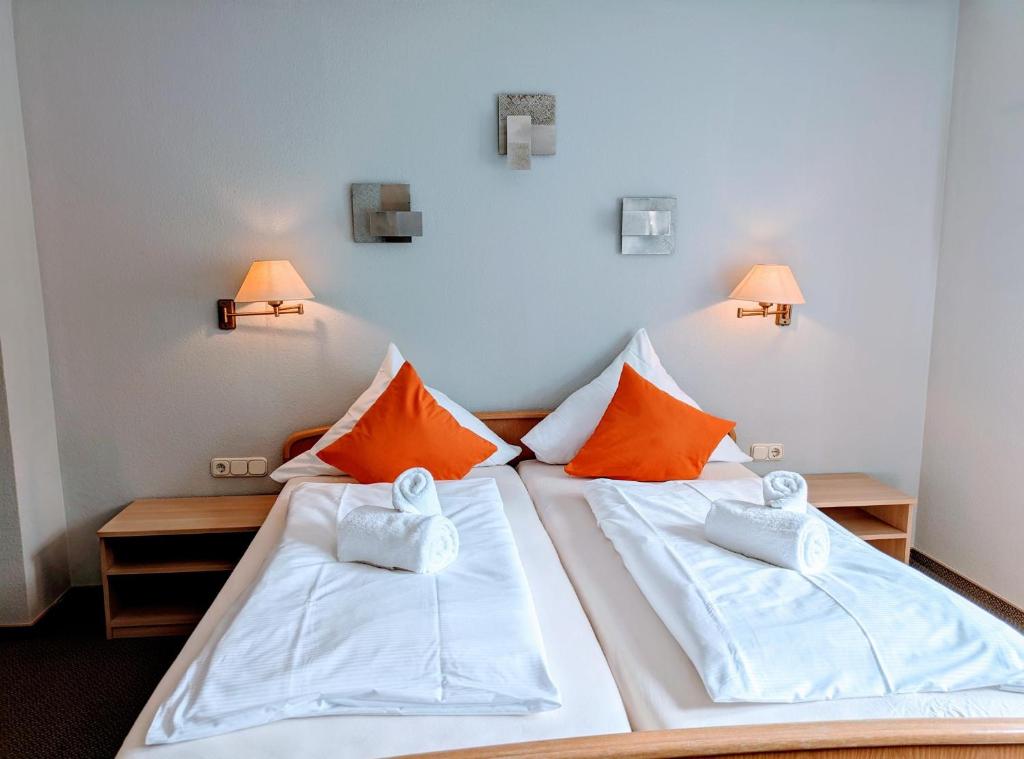 Postel nebo postele na pokoji v ubytování Hotel Walzwerk