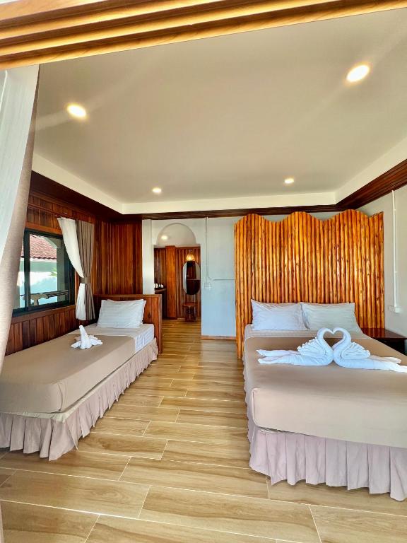 Ein Bett oder Betten in einem Zimmer der Unterkunft Pen's Bungalow Koh Phangan