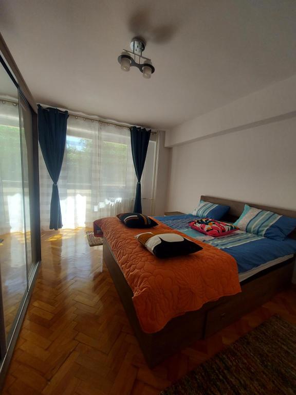 Postel nebo postele na pokoji v ubytování La Tine Acasă Rezidence