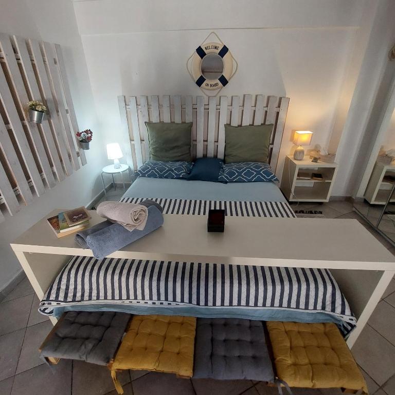 a bedroom with a large bed in a room at LOBBY comfort studio in Thessaloniki