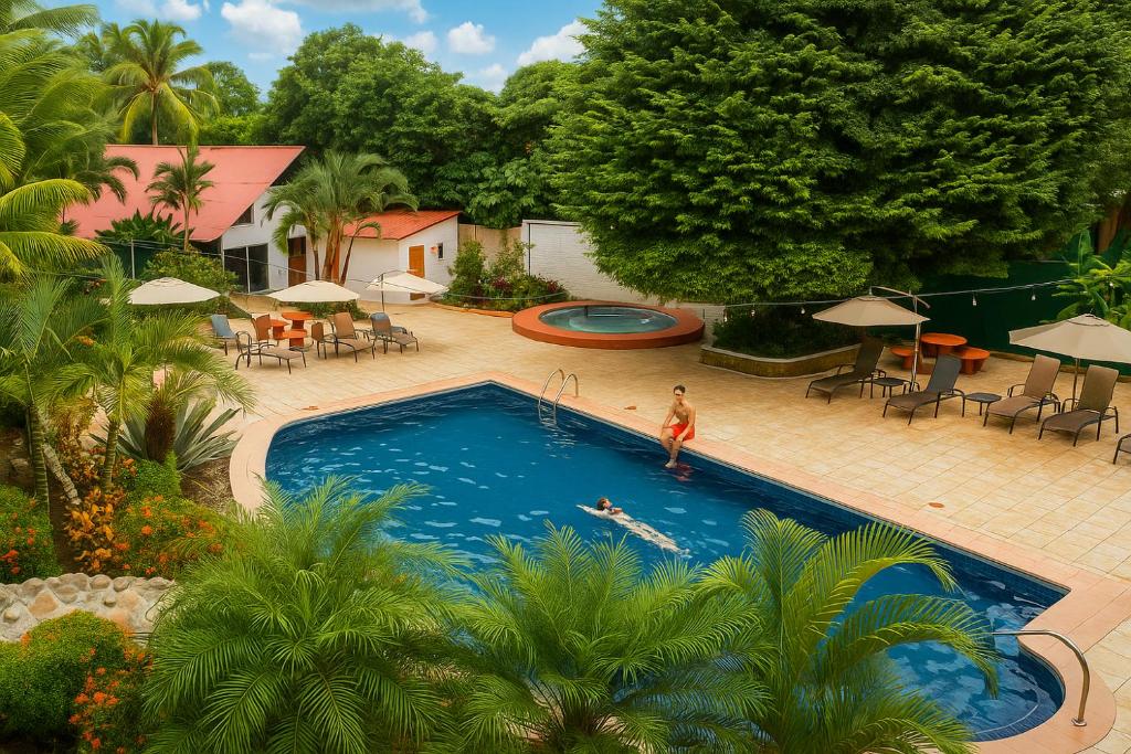 Bazén v ubytování Hotel Divisamar by LHR nebo v jeho okolí