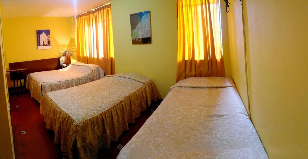 Postel nebo postele na pokoji v ubytování Hostal Iquique