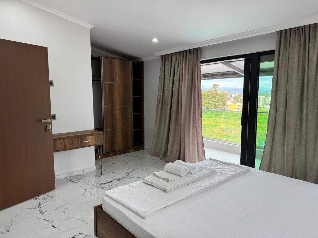 Postel nebo postele na pokoji v ubytování Magnetiti Hotel