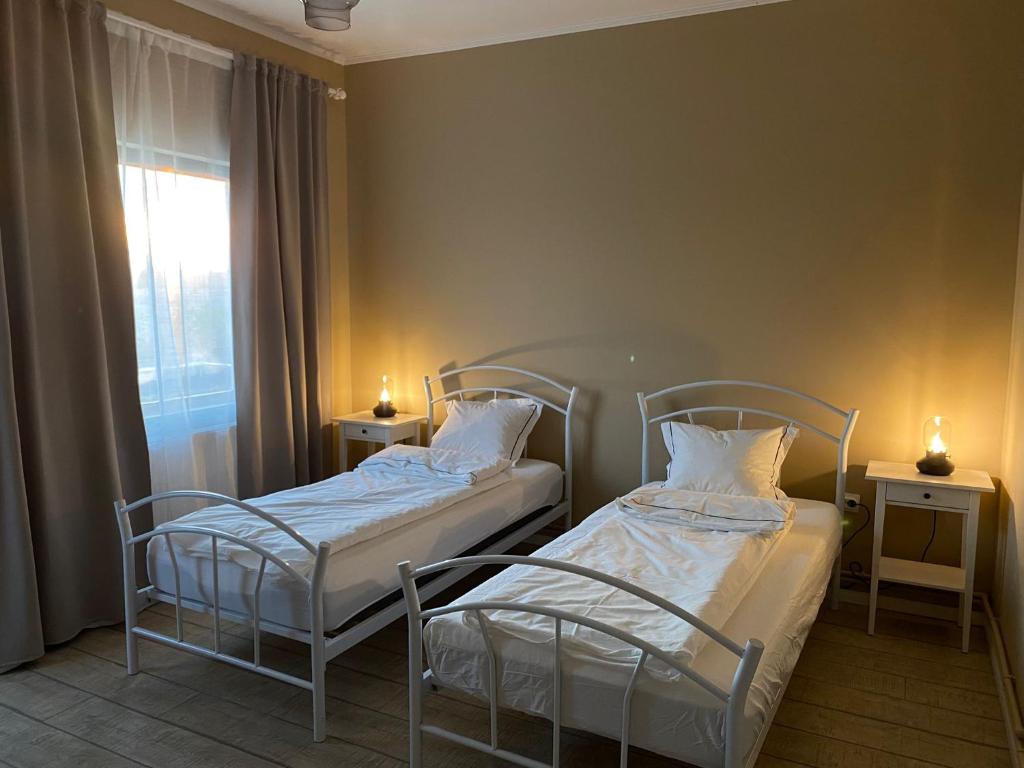 Postel nebo postele na pokoji v ubytování REȘEDINȚA PRINȚESELOR