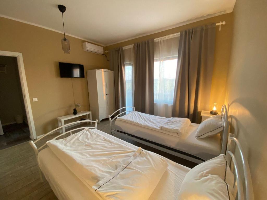 Postel nebo postele na pokoji v ubytování REȘEDINȚA PRINȚESELOR