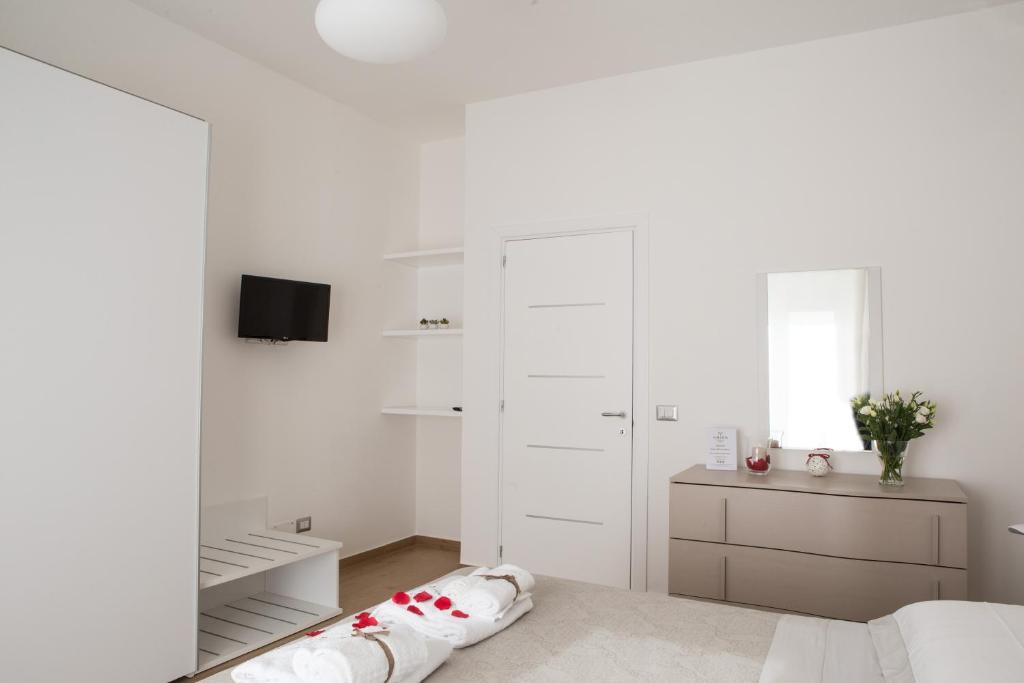 Televízia a/alebo spoločenská miestnosť v ubytovaní B&B Aries