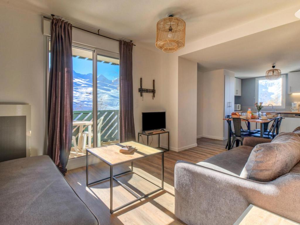 a living room with a couch and a table at Appartement 3 Pièces 6 Personnes MAE-9803 in Germ