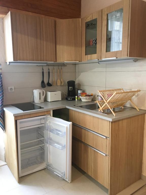 a kitchen with wooden cabinets and a counter top at le studio du lac in Annecy