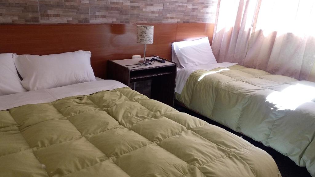 Postel nebo postele na pokoji v ubytování Inka's Rest Hostel