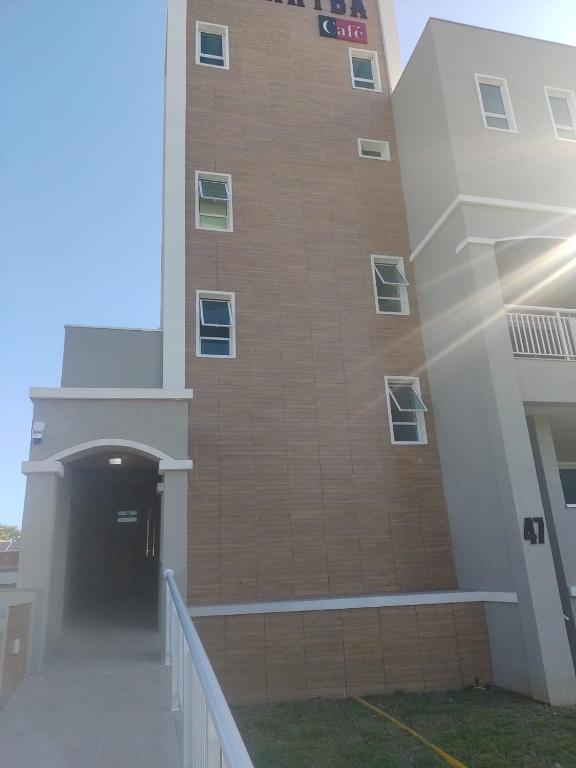 a building with a hallway leading to a tunnel at Flat Flecheiras in Trairi