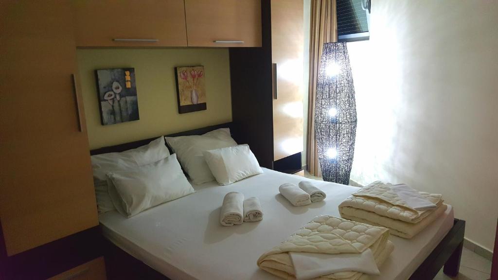 Postel nebo postele na pokoji v ubytování Apartments Rino Lux