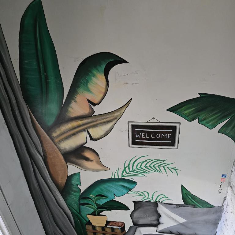 a mural of a wall with leaves on a wall at Balacobaco in Brussels