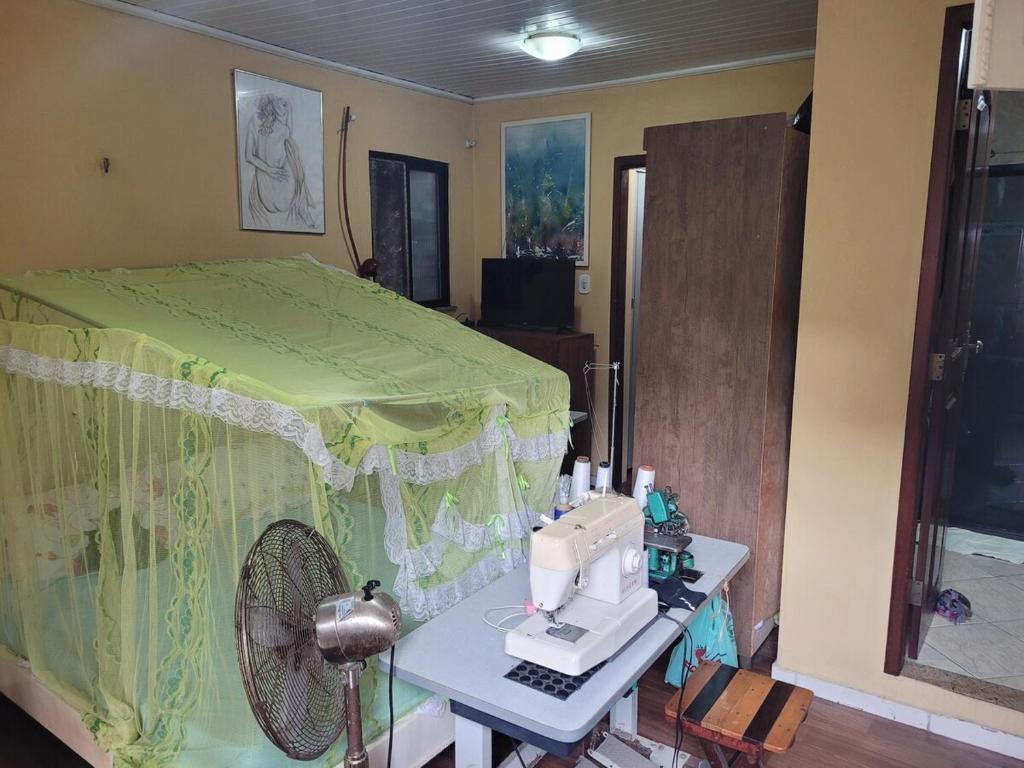 a room with a sewing machine on a table at Entire home COP 30 next to Hangar in Belém