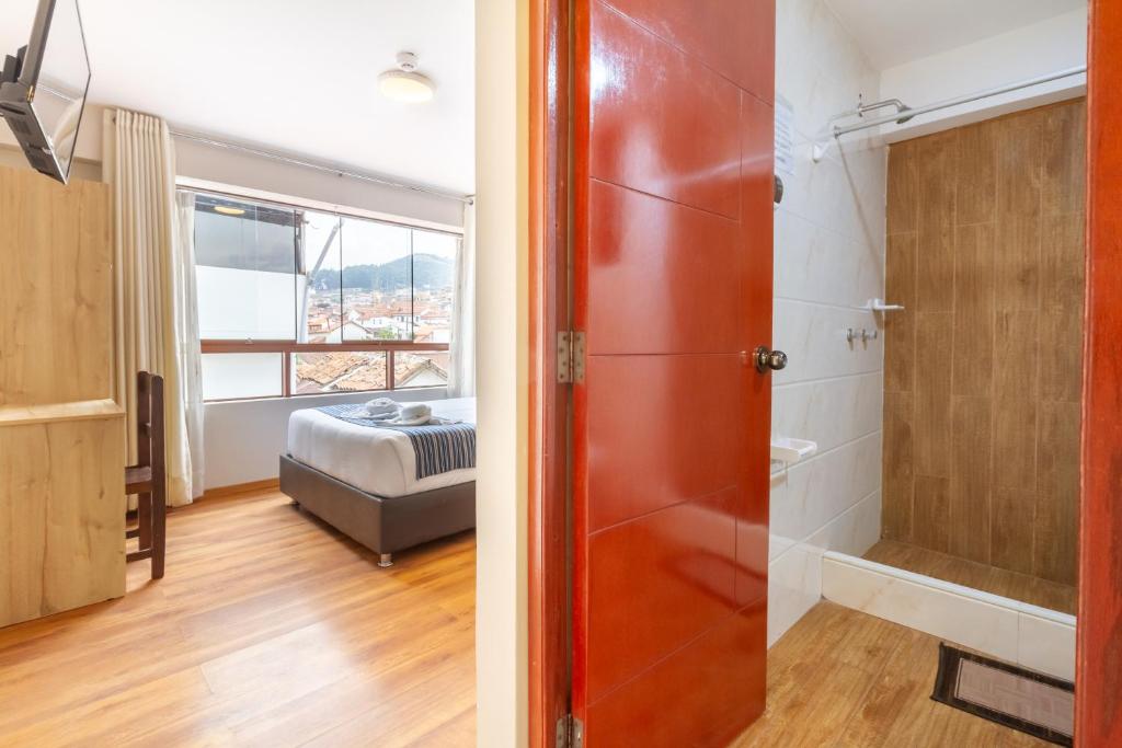 Postel nebo postele na pokoji v ubytování Cusco Hostal Qolla Wasi-II