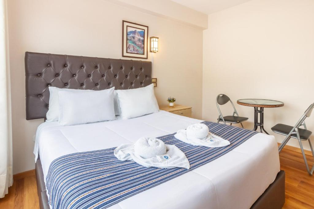 Postel nebo postele na pokoji v ubytování Cusco Hostal Qolla Wasi-II