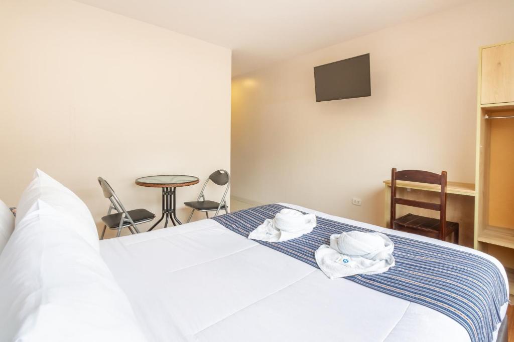 Postel nebo postele na pokoji v ubytování Cusco Hostal Qolla Wasi-II