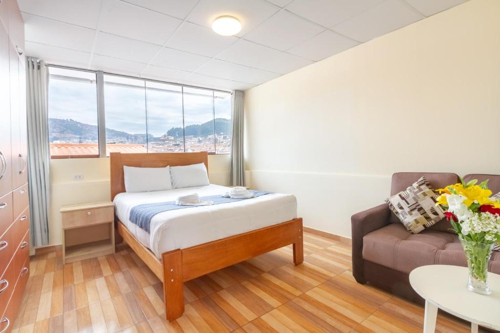 Postel nebo postele na pokoji v ubytování Cusco Hostal Qolla Wasi-II