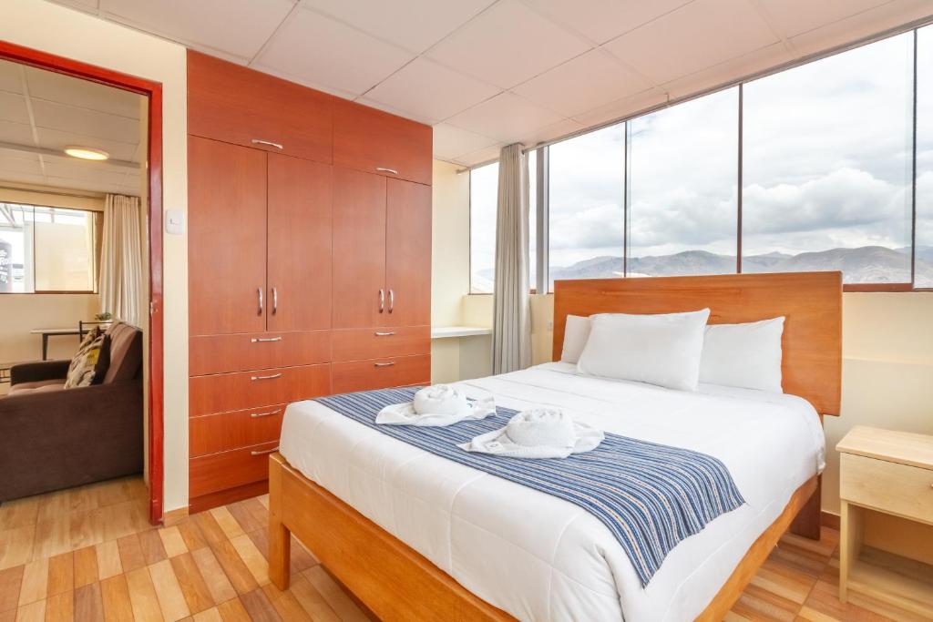 Postel nebo postele na pokoji v ubytování Cusco Hostal Qolla Wasi-II