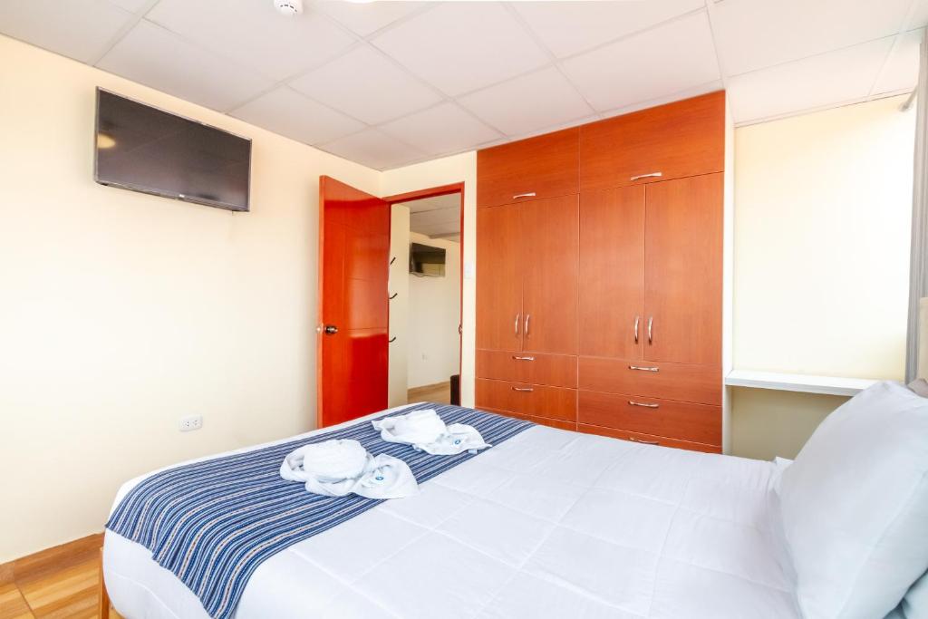 Postel nebo postele na pokoji v ubytování Cusco Hostal Qolla Wasi-II