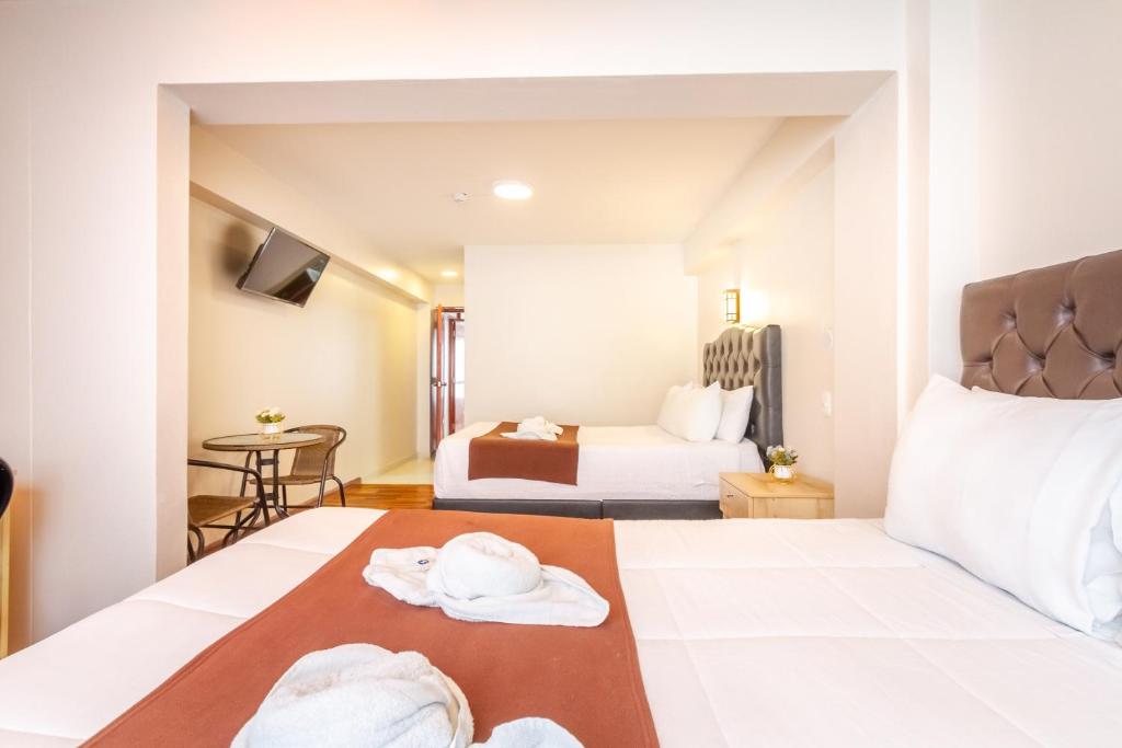 Postel nebo postele na pokoji v ubytování Cusco Hostal Qolla Wasi-II