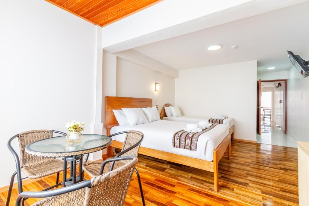 Postel nebo postele na pokoji v ubytování Cusco Hostal Qolla Wasi-II