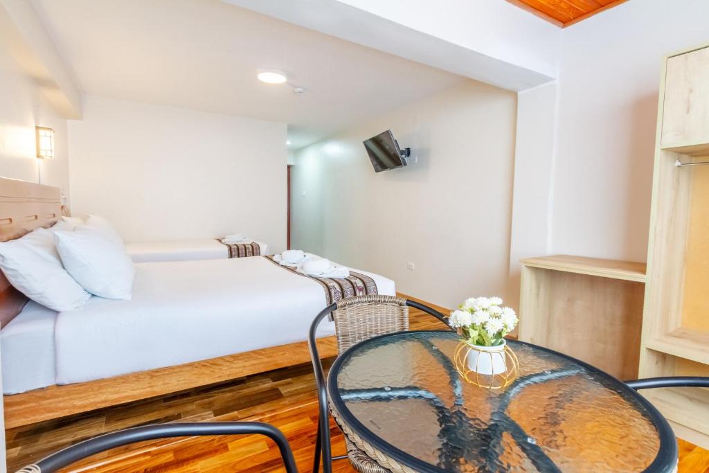 Postel nebo postele na pokoji v ubytování Cusco Hostal Qolla Wasi-II
