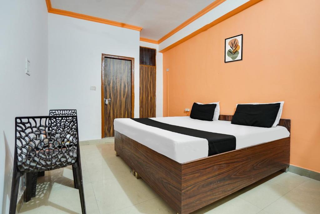 Postel nebo postele na pokoji v ubytování Hotel O Harmony