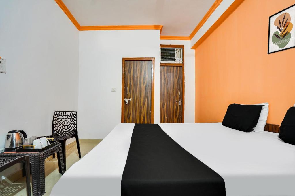 Postel nebo postele na pokoji v ubytování Hotel O Harmony