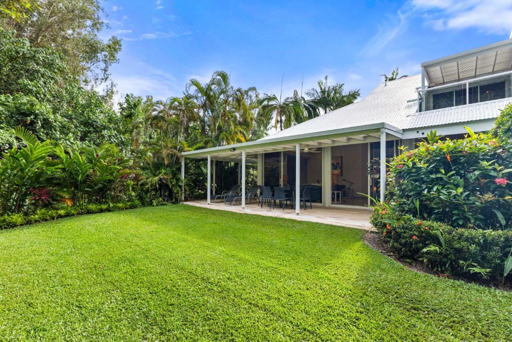 an exterior view of a house with a yard at Mirage Resort Villa 456 with access to Sheraton Facilities in Port Douglas
