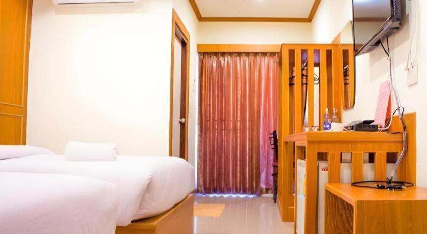 Postel nebo postele na pokoji v ubytování Loei Residence