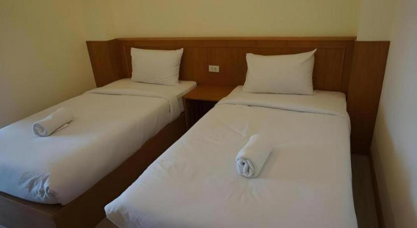 Postel nebo postele na pokoji v ubytování Loei Residence