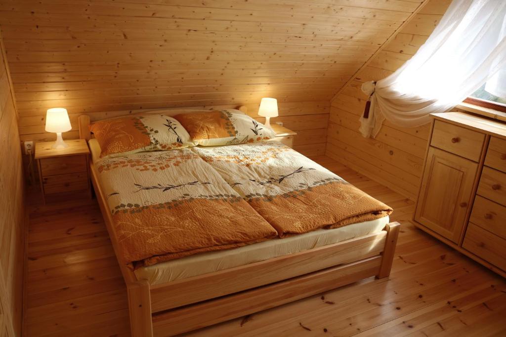 Postel nebo postele na pokoji v ubytování Domek z Bala Pod Żaglami