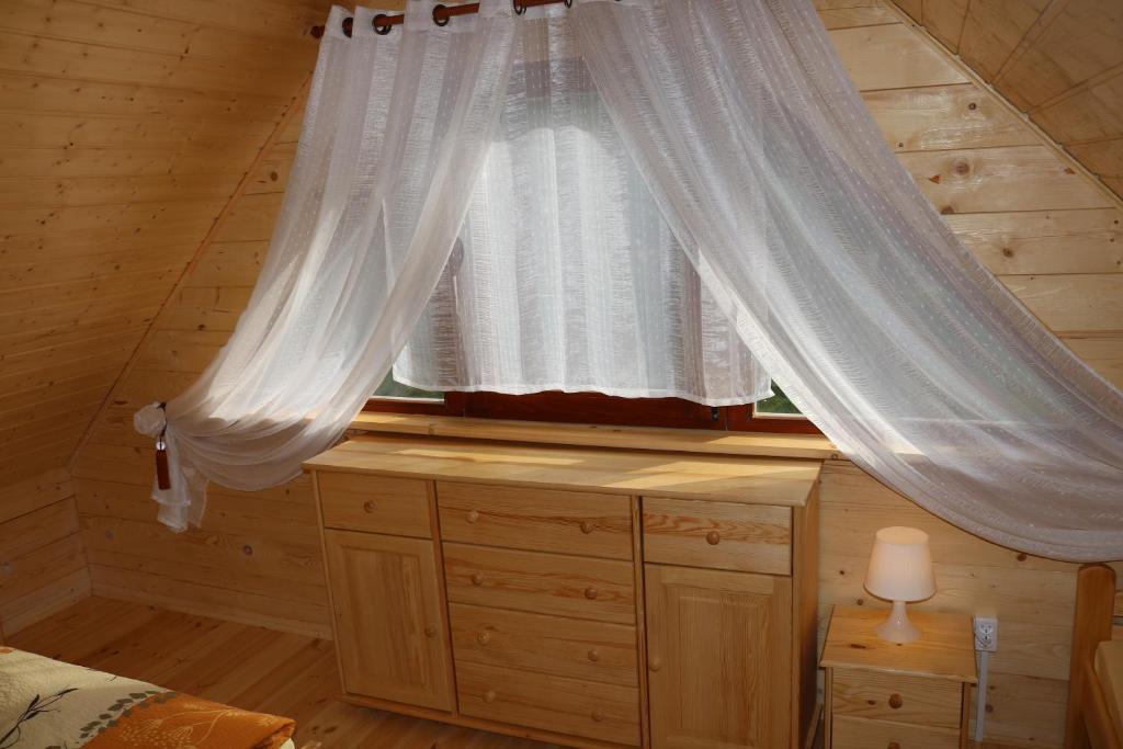 Postel nebo postele na pokoji v ubytování Domek z Bala Pod Żaglami