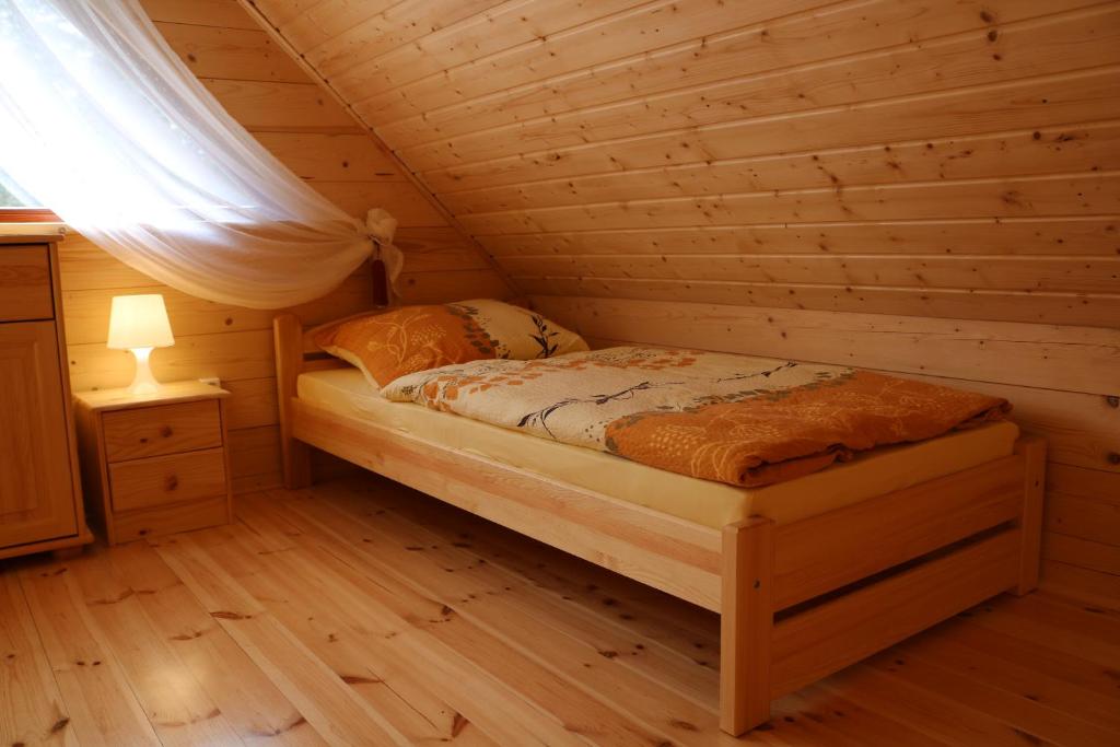 Postel nebo postele na pokoji v ubytování Domek z Bala Pod Żaglami