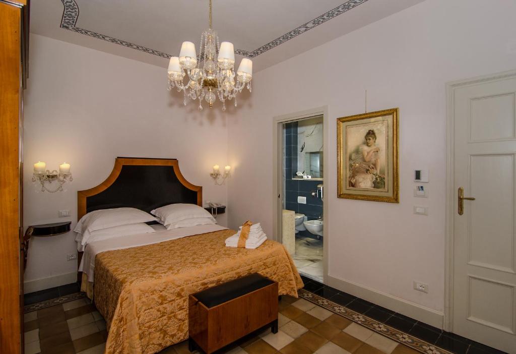Postel nebo postele na pokoji v ubytování Lucca in Azzurro Maison de Charme