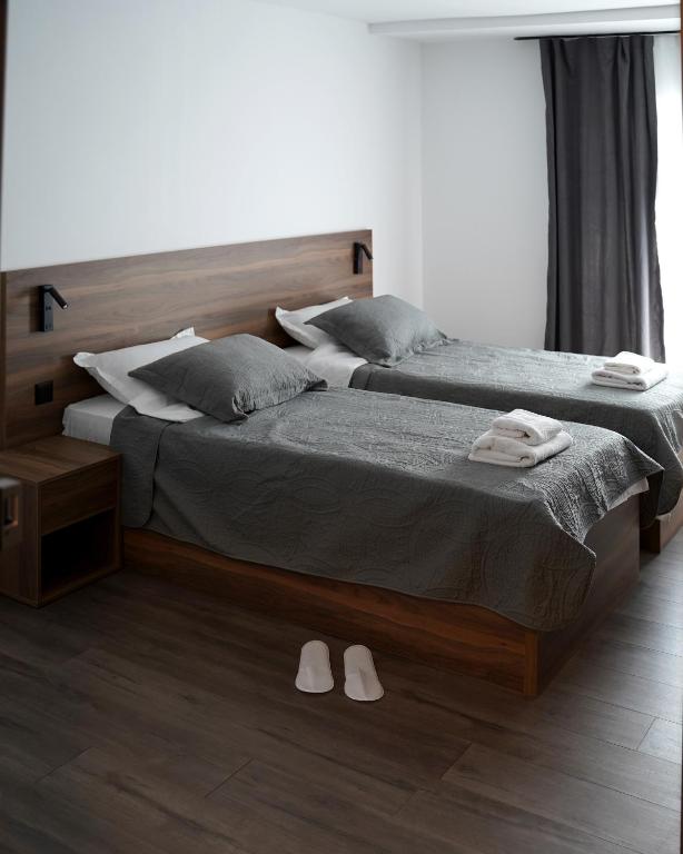 Postel nebo postele na pokoji v ubytování Fole Apart Hotel