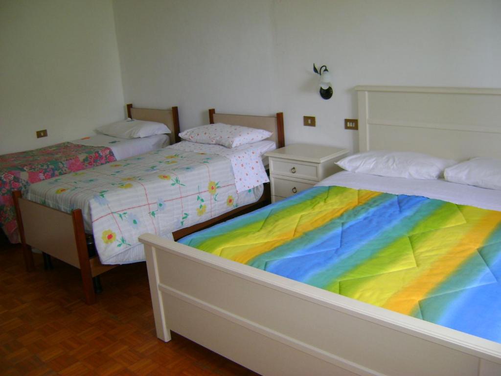 Postel nebo postele na pokoji v ubytování B&B La Mimosa