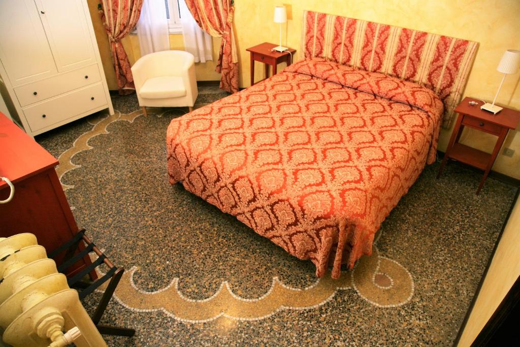 Postel nebo postele na pokoji v ubytování Hotel Delle Rose