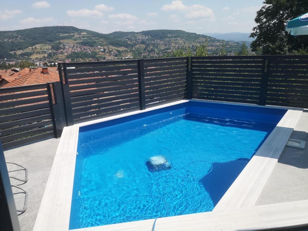 a swimming pool on the roof of a house at Villa Sun Visoko in Visoko