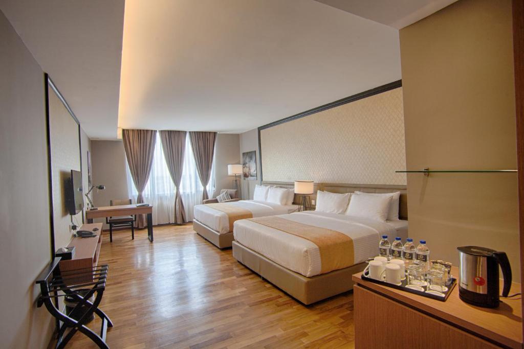 Postel nebo postele na pokoji v ubytování Millesime Hotel Johor Bahru