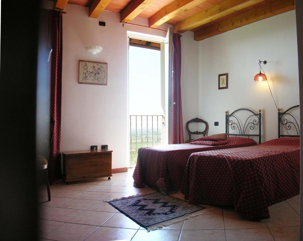 Letto o letti in una camera di Le Bianchette Agriturismo e Fattoria Didattica