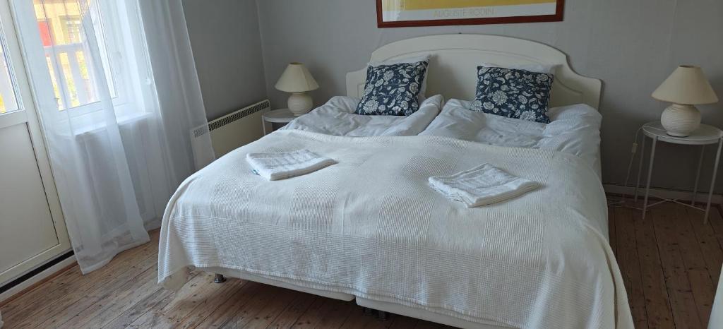 Postel nebo postele na pokoji v ubytování Nösundsgården Hotell & Vandrarhem