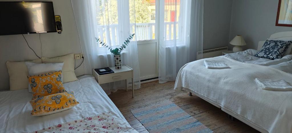 Postel nebo postele na pokoji v ubytování Nösundsgården Hotell & Vandrarhem