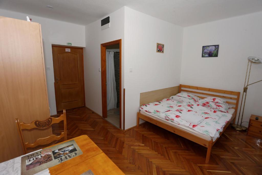 Postel nebo postele na pokoji v ubytování Total Relax Apartmanház