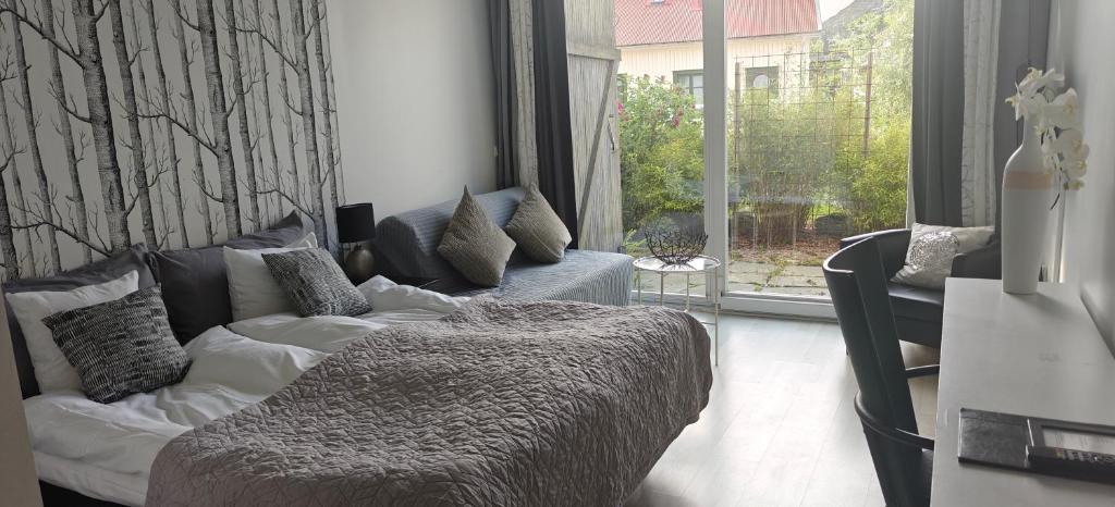 Postel nebo postele na pokoji v ubytování Nösundsgården Hotell & Vandrarhem