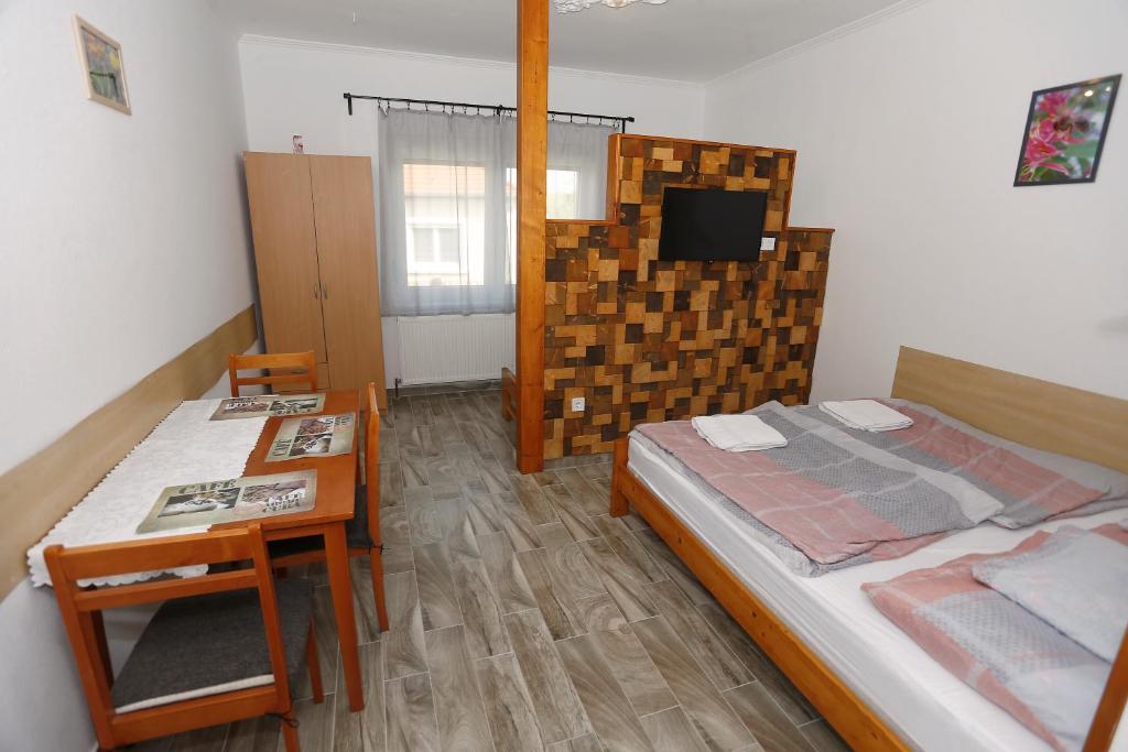 Postel nebo postele na pokoji v ubytování Total Relax Apartmanház