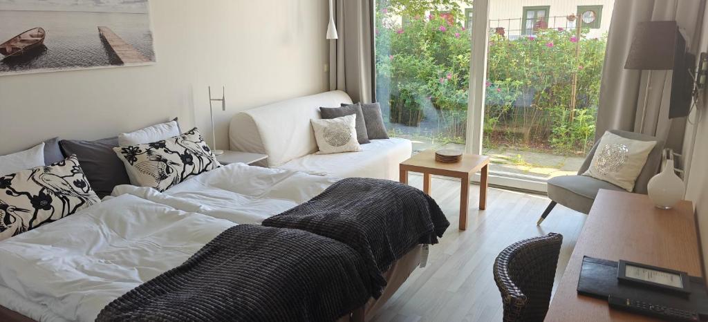 Postel nebo postele na pokoji v ubytování Nösundsgården Hotell & Vandrarhem