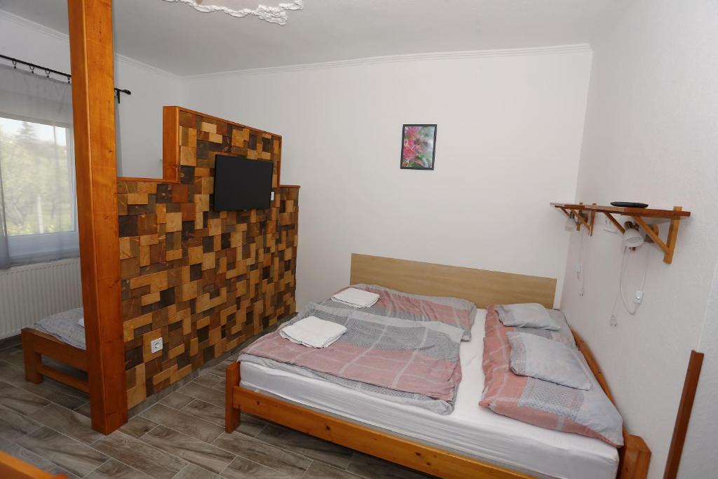 Postel nebo postele na pokoji v ubytování Total Relax Apartmanház