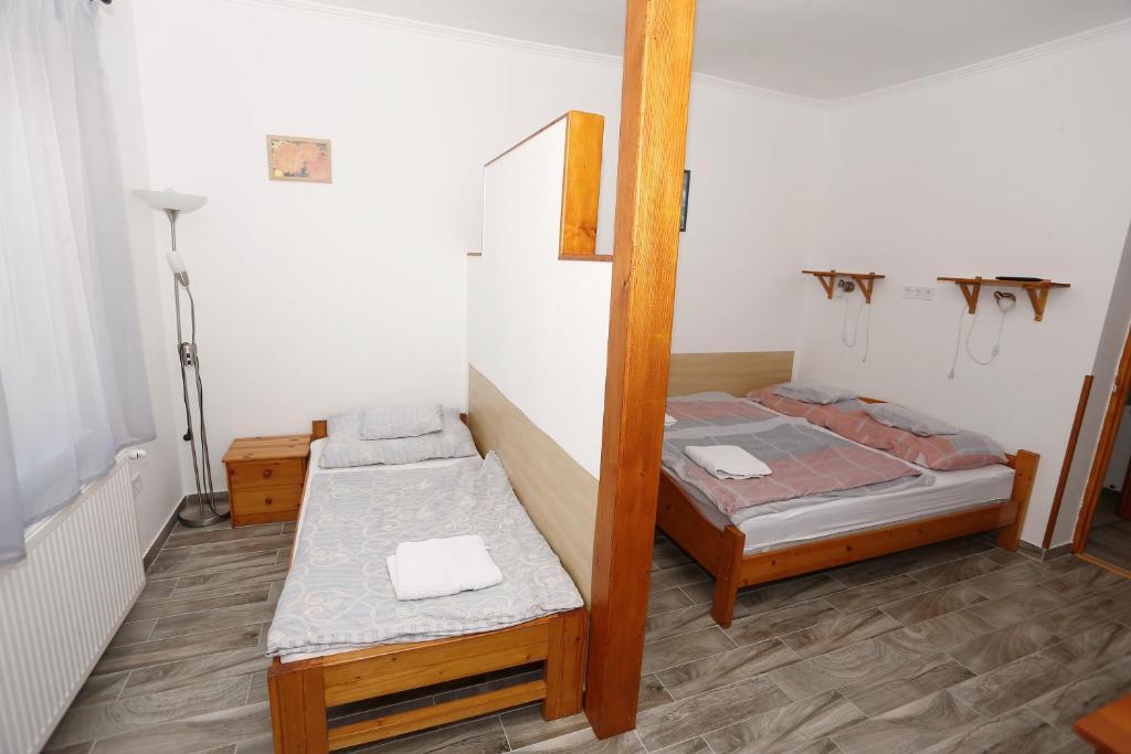 Postel nebo postele na pokoji v ubytování Total Relax Apartmanház